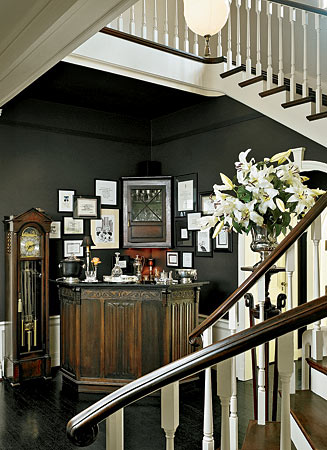 It’s a foyer. It’s a bar. It’s a foyer and a bar. Why not make the most of the space? Framed pictures and memorabilia express personality; the owners of this house display hand-lettered and illustrated quotes by Dorothy Parker.