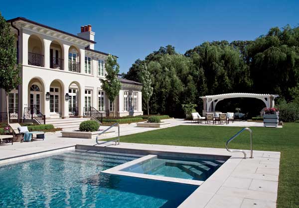 The terrace features a pool with a hot tub and a lawn where the grandchildren play. The grass gives the eye a place to rest, Furlan points out. Limestone from Indiana and Wisconsin was used in the hardscaping.