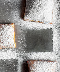 Beignets covered in powdered sugar from Jimmy's Pizza Café