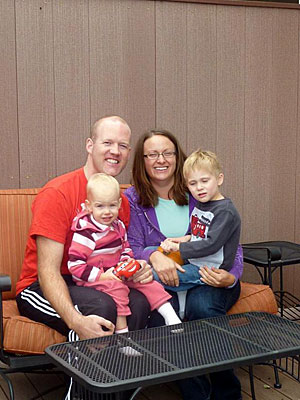 Drew Walker, his wife, Jill, and their two children