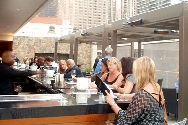 Patrons at the bar at III Forks