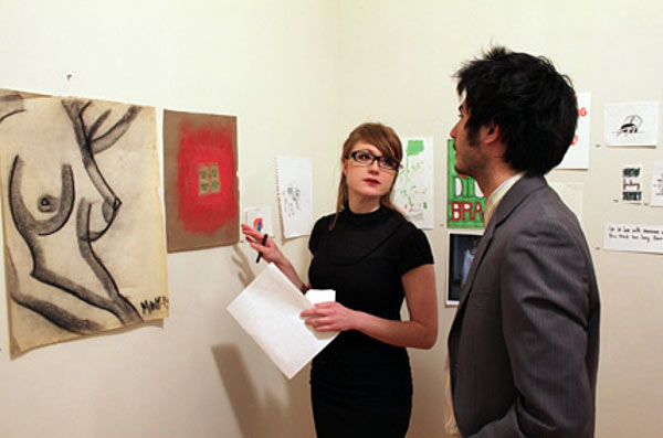 Jennifer Mills showing off art pieces