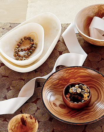 Alabaster bowls, Clyde Bill Brown wood bowls, and strings of stone beads