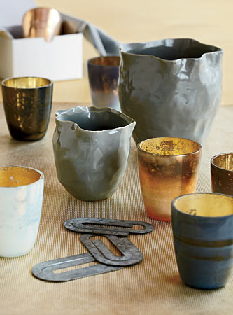 Ruffled-lip ceramic vases, mercury glass votives, and oversize zinc paper clips