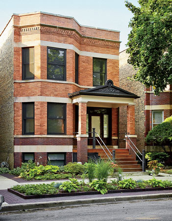 The house looks like a typical Chicago two-flat from the street, but it was blown out to allow for open space inside.