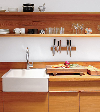 A cutting board sits on the cypress veneer countertop in Uusi cofounder Peter Dunham’s kitchen.