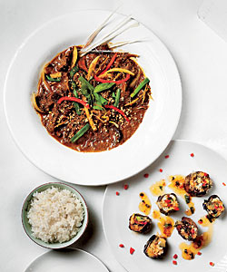 Curried beef garnished with lemon leaves and roasted peanuts; (below) grilled eggplant stuffed with ground shrimp