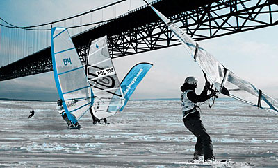 Wind surfers under the Mackinac Bridge