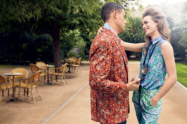 On him: HART SCHAFFNER MARX batik jacket, and linen shirt; On her: SPORTMAX silk crepe top, and silk habutai shorts, and MARNI necklace