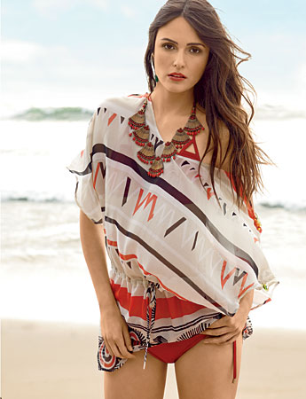 LALESSO silk and cotton caftan, VITAMIN A recycled nylon bikini, and SUZANNA DAI earrings, and necklace