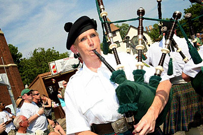A bagpipe player participating in the Irish American Heritage Festival