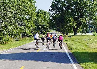 Cyclists pedaling through Stockbridge, Michigan