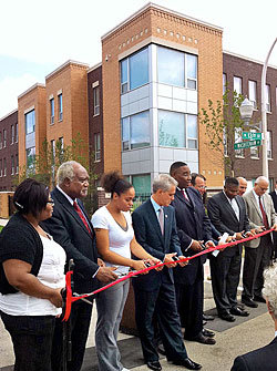 Congressman Danny Davis, Mayor Rahm Emanuel, and Alderman Jason Ervin join tenants and others at the ribbon-cutting ceremony Tuesday at the Park Douglas Apartments.