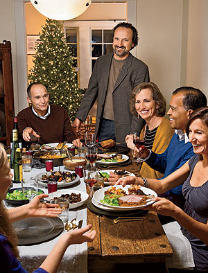 Bruce Sherman(standing), North Pond's executive chef, at home in Evanston with good friends and his wife, Joan (third from left)