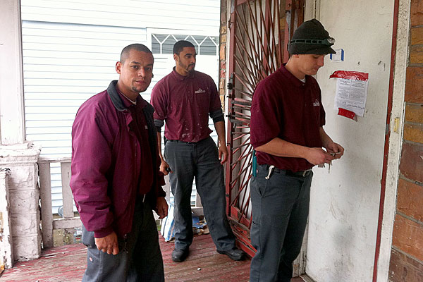 Workers from 180 Properties at a two-flat in Riverdale