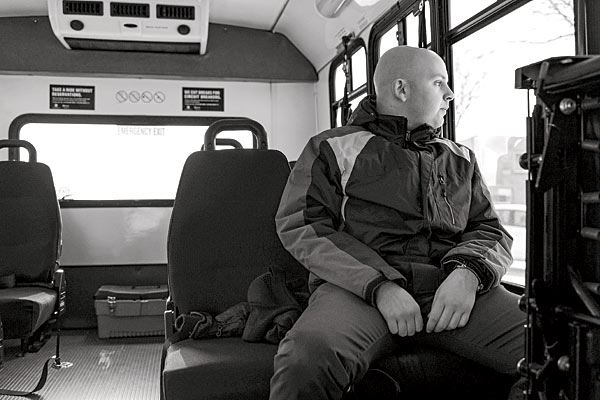 Josh Stern, 24, who is autistic, rides a Pace paratransit bus to his job at a North Shore bank.
