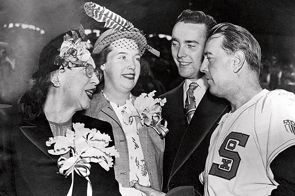 Grace Comiskey, Dorothy Comiskey, Chuck Comiskey, and Sox manager Ted Lyons in 1948
