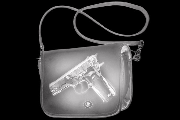 An X-ray of a handgun in a purse
