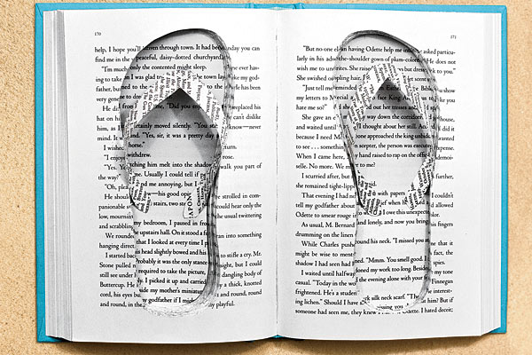 A book with flip-flops cut out of the pages