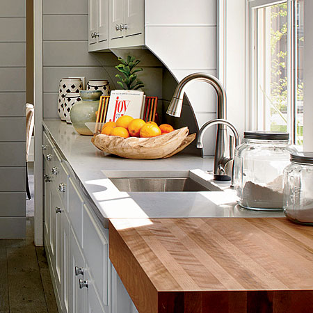 A butcher block next to the prep sink