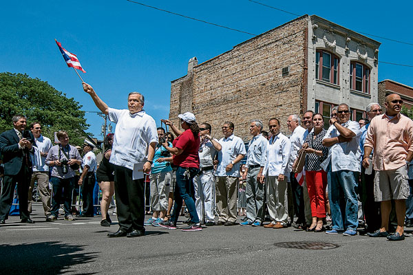 Lopez marches in the Puerto Rican People’s Parade in Humboldt Park in June. Among the dignitaries behind him are Mayor Emanuel and Governor Quinn.