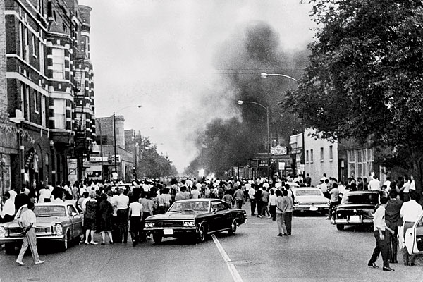 smoke rises from a burning police car during a three-day race riot on Division Street in Humboldt Park in 1966