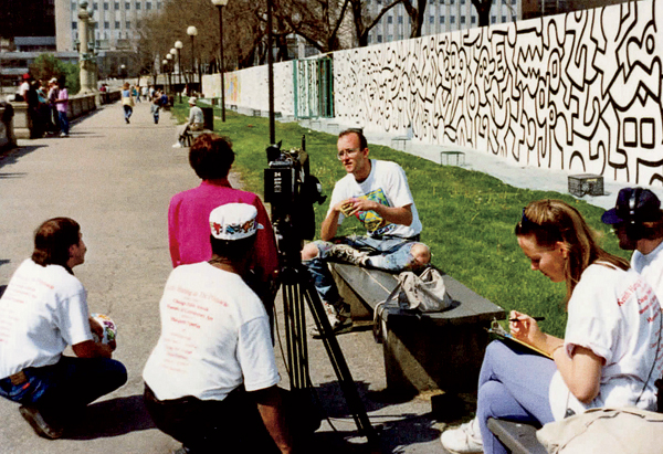Haring giving an interview during the May 1989 installation in Grant Park.