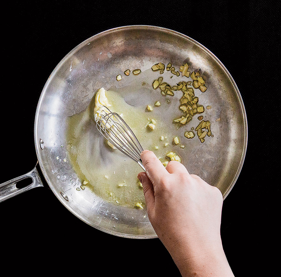 Garlic being sauteed in oil