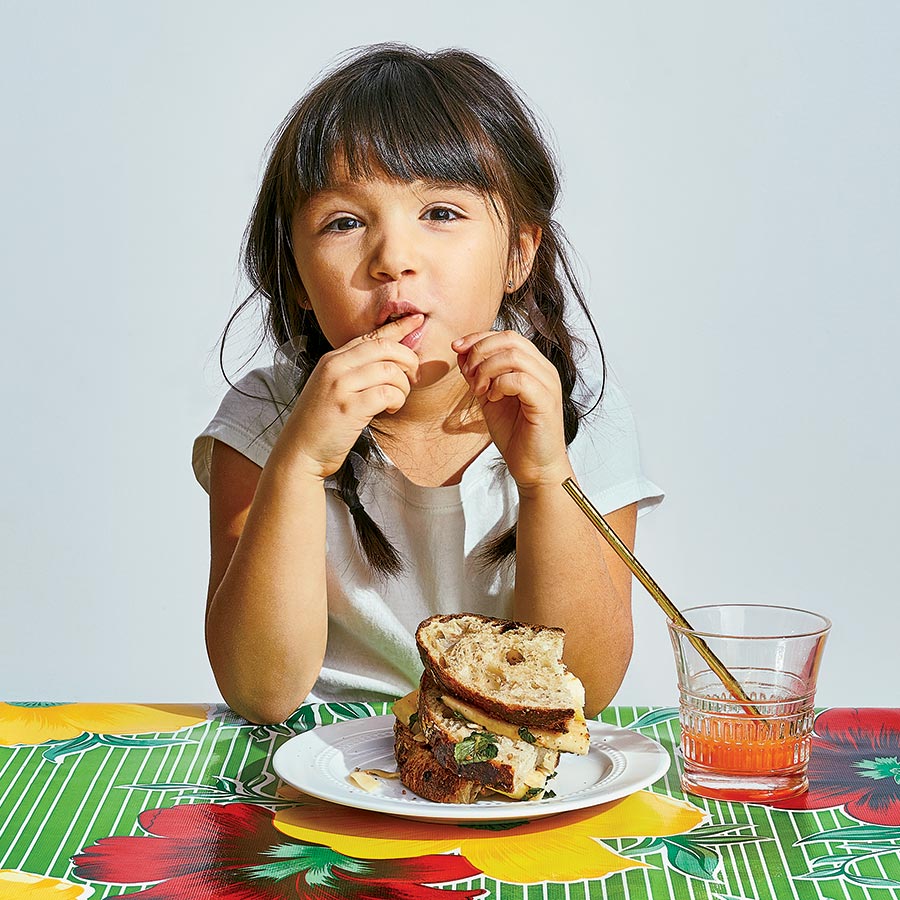 Esperanza eating a Banh mi–Style PB&J Sandwich