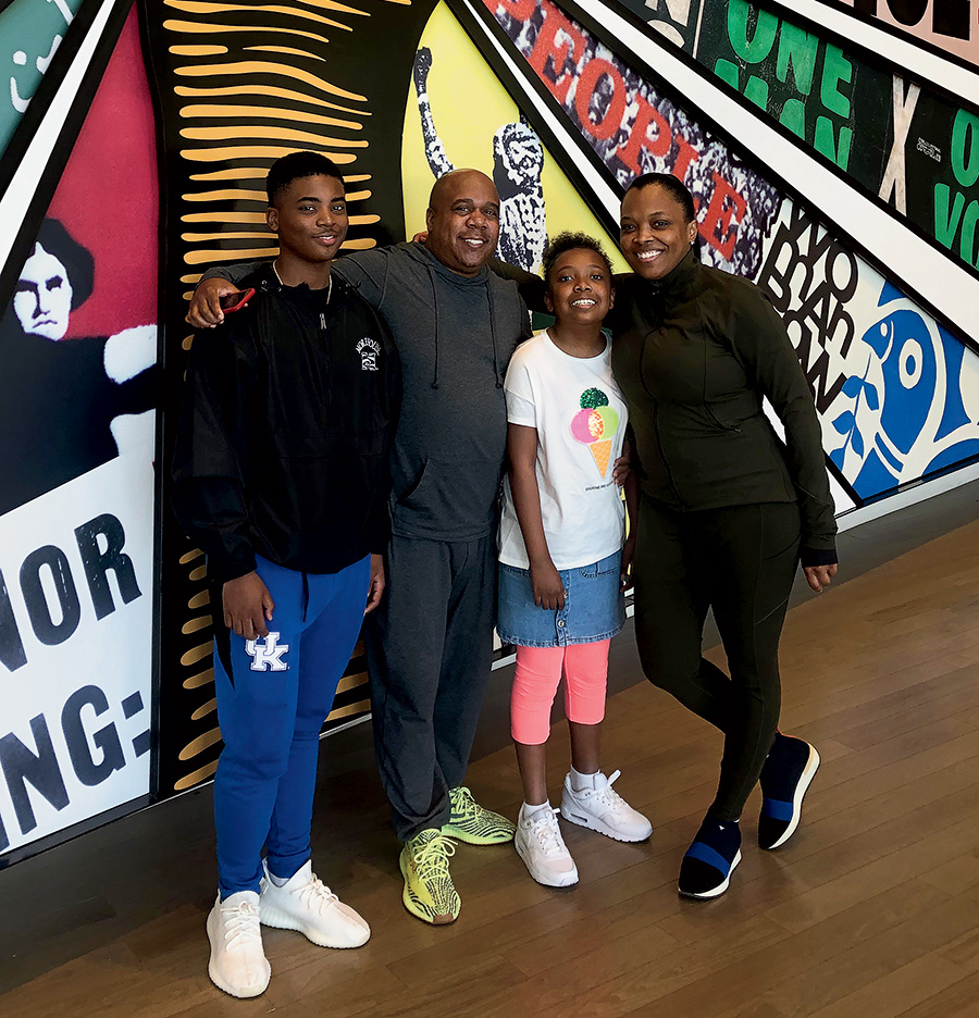 With her husband, stepson, and daughter on a family trip in April