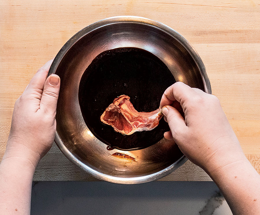 Coating lamb chops in marinade