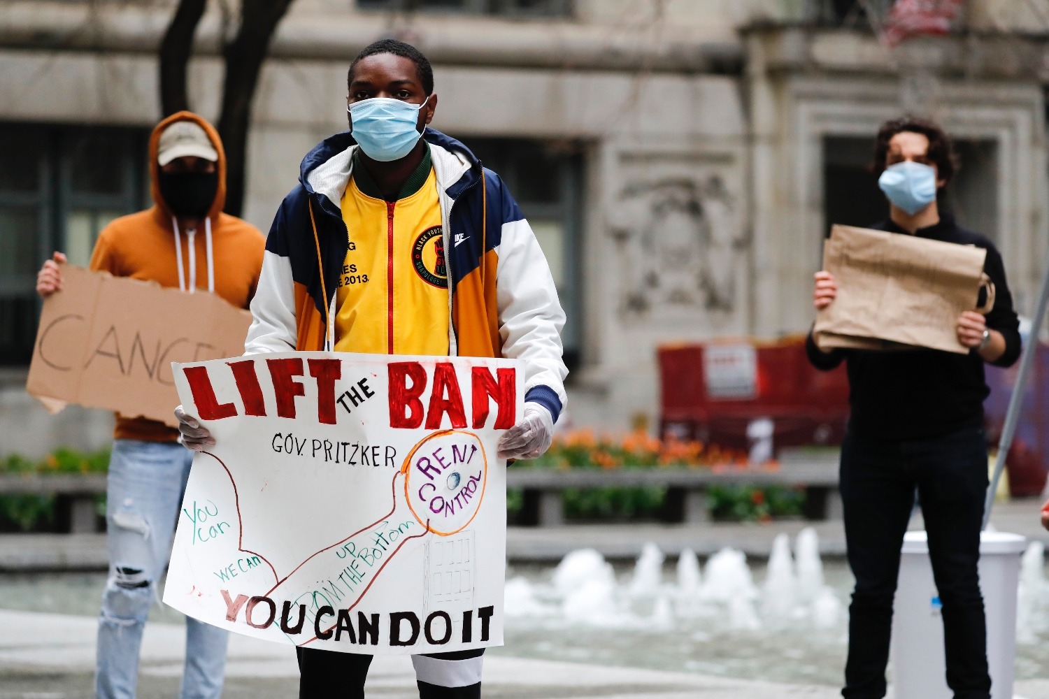 Members of the Lift the Ban Coalition gather at Daley Plaza in Chicago on Thursday, April 30, 2020