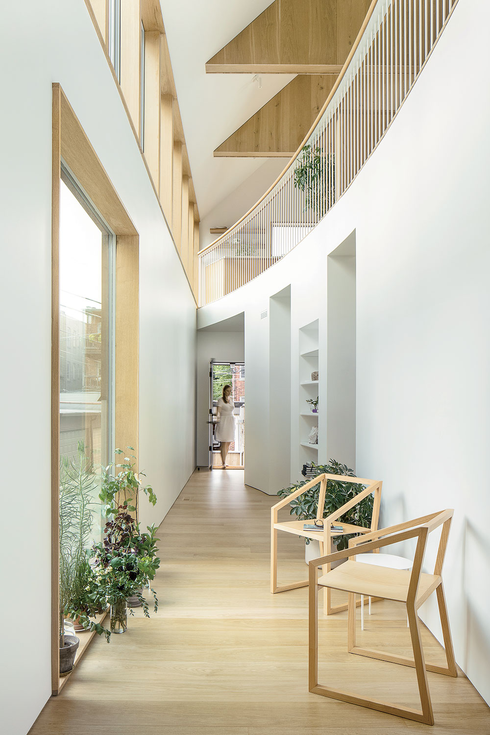 Lap Chi Kwong and Alison Von Glinow gave their Edgewater residence a curved atrium instead of a traditional entrance foyer and hallway.