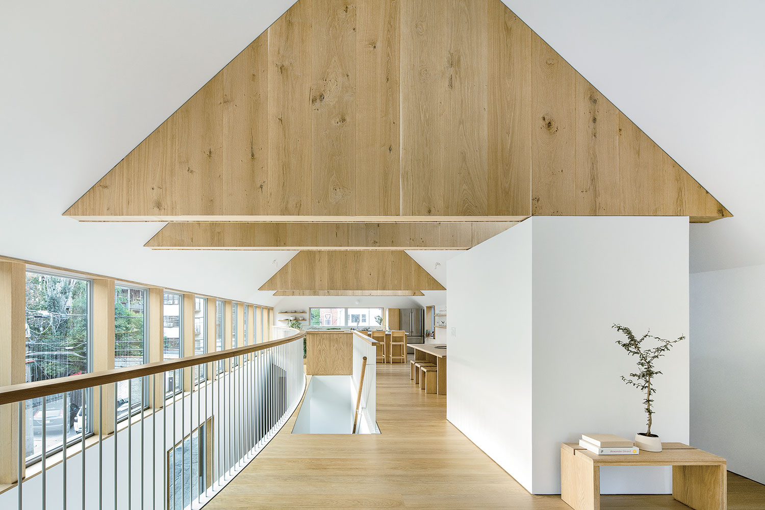 On the top floor, the couple modernized the traditional enfilade, which creates divisions without hallways. Each oak truss defines a room. “We like to take these historically popular architectural concepts and smuggle them in,” Von Glinow says.