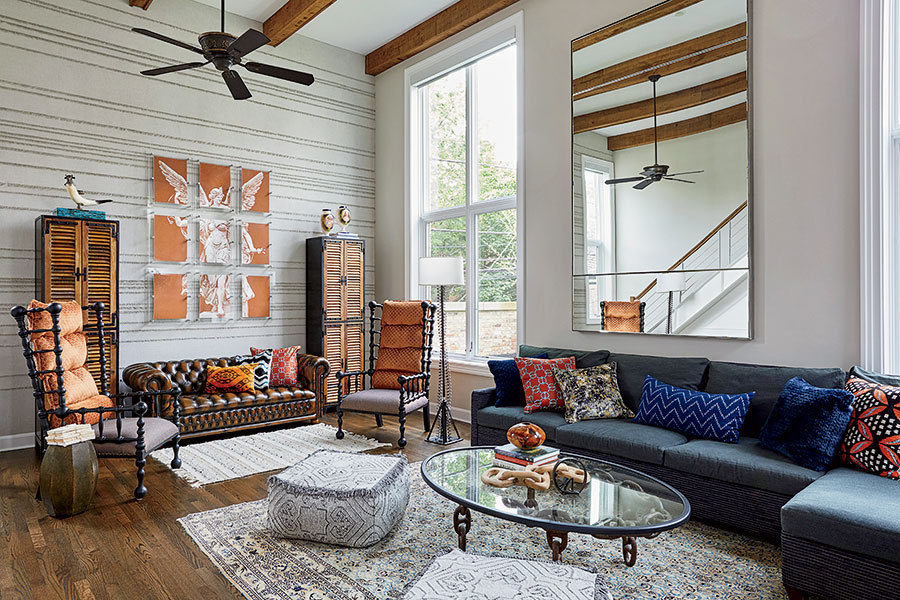 Julia Buckingham added a giant mirror to match the windows in the voluminous family room.