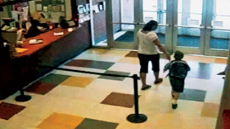 Surveillance video captured Amy Fry-Pitzen checking out of the Kalahari Resort in Wisconsin Dells; this is the last known image of Timmothy Pitzen.