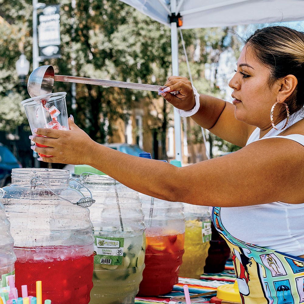 Yuri Tamayo pours aguas frescas at Riri’s WaterBar