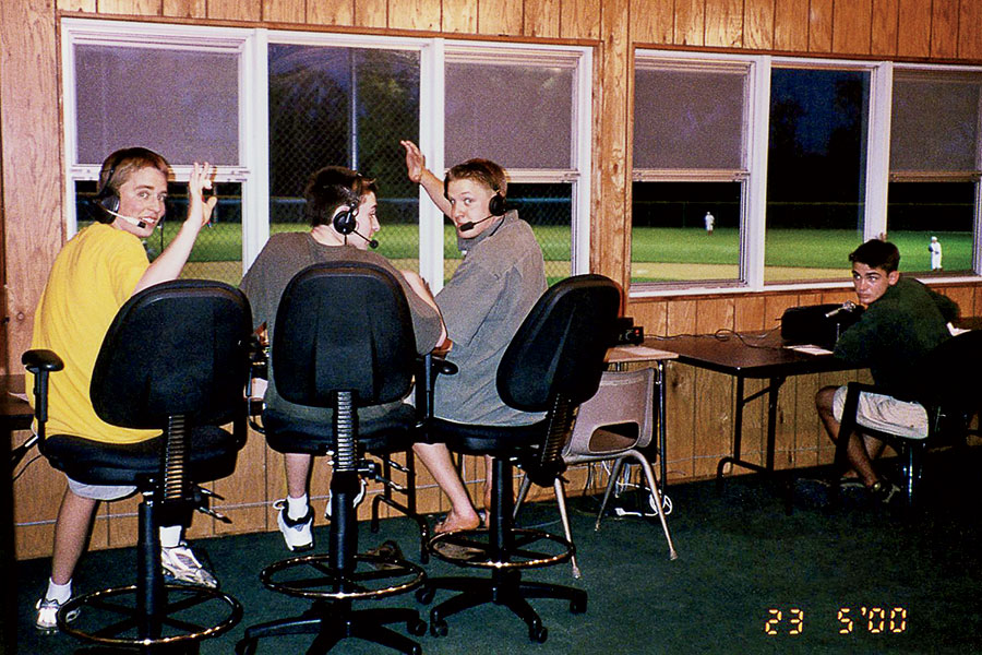 Shown here, second boy from left, Benetti calls a 2000 game in the Homewood-Flossmoor High School broadcast booth.