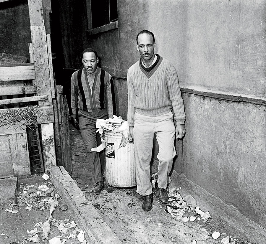 King (left) and Albert Raby clean up garbage from an apartment at 1321 South Homan Avenue, in Chicago’s Lawndale neighborhood, on February 23, 1966.