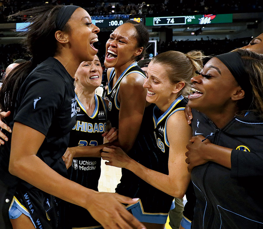 Homegrown star Candace Parker (left) celebrates with her Sky teammates after their title-clinching win in October.