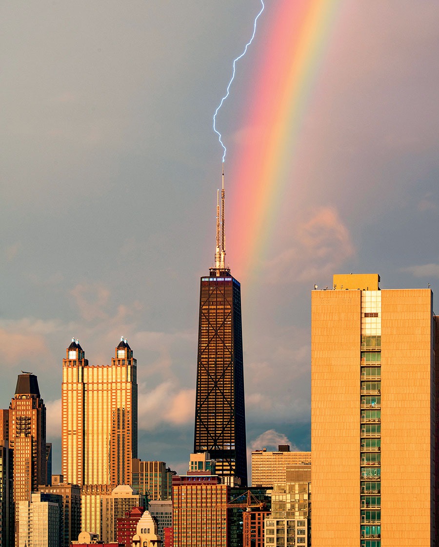 A rainbow backdrops a lighting strike at the 875 North Michigan Avenue tower.
