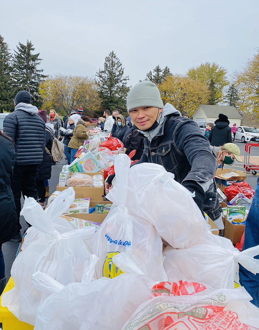 Huynh in November collecting food for an event held by his nonprofit, Chicago Peace