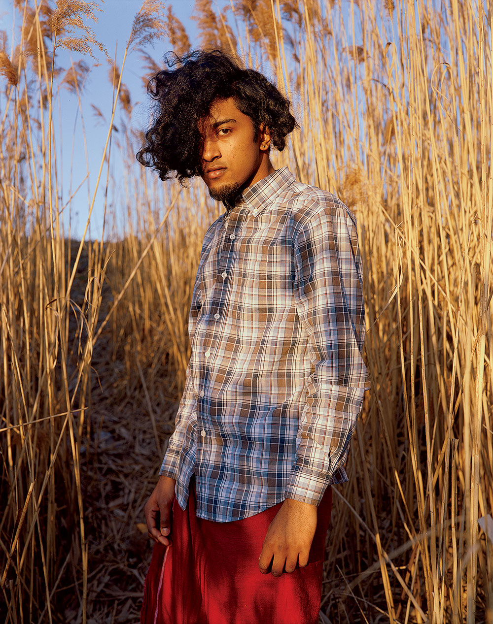 Man posing in tall grass