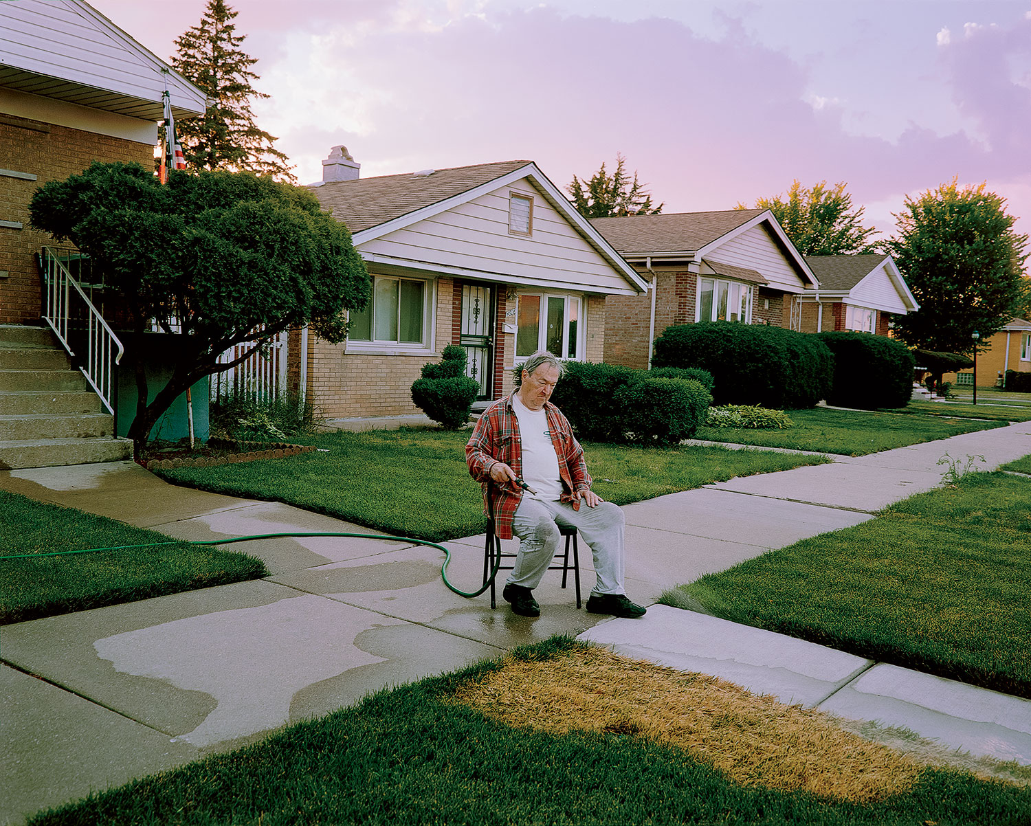 Man watering grass