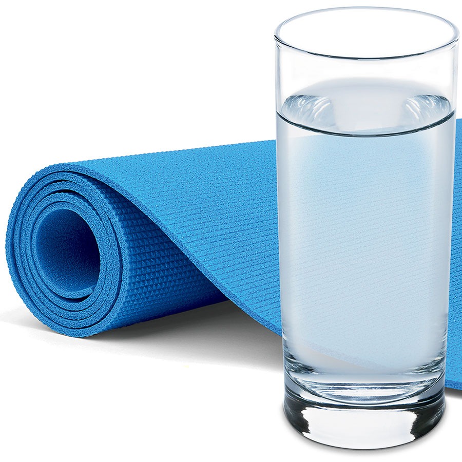 A yoga mat and a glass of water