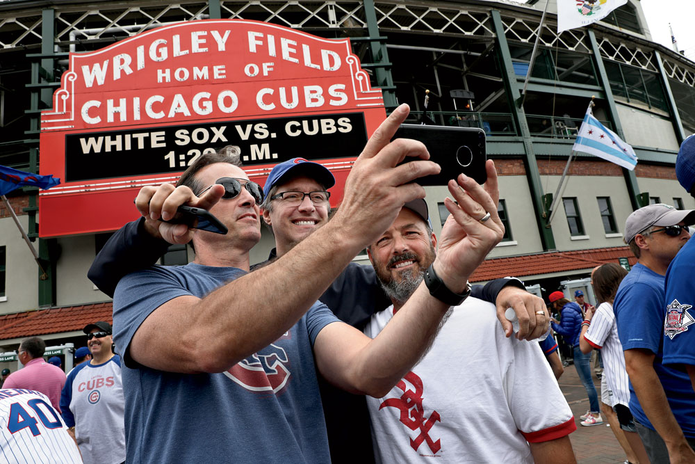 Chicago Cubs and White Sox fans brawl in a suite, while one