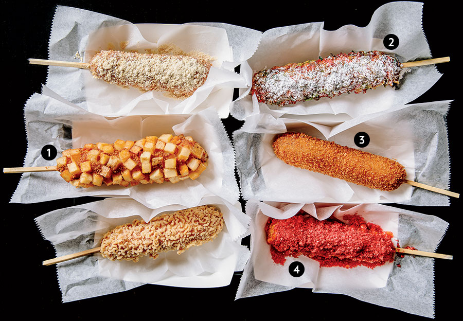 Spaghetti dog; Rainbow cereal on plant-based sausage; Original coating on beef sausage; Flamin’ Hot Cheetos on half-mozzarella, half-beef; Ramen dog; and Fried potato on mozzarella from Kong Dog