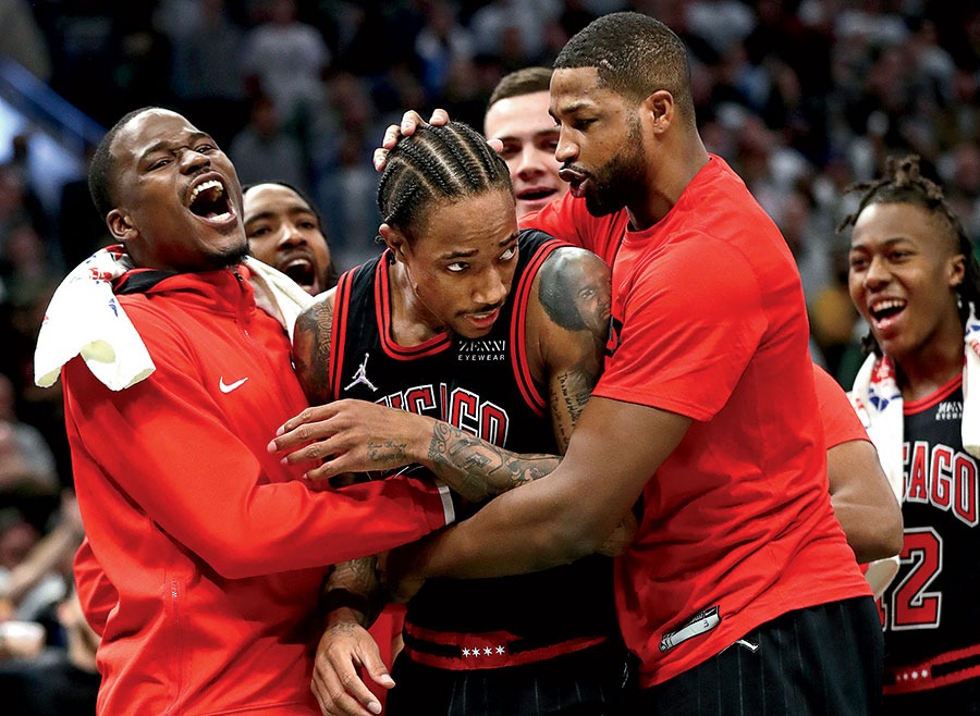 DeRozan after Game 2 of the playoffs, surrounded by teammates