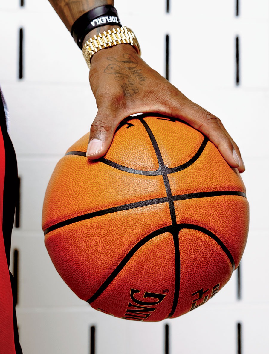 DeRozan's hand palmng a basketball