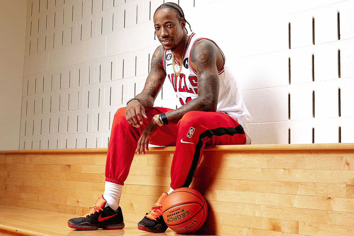 DeMar DeRozan sitting on the bleachers